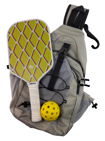 Gray sling bag with Argyle pickleball paddle and ball on a white background