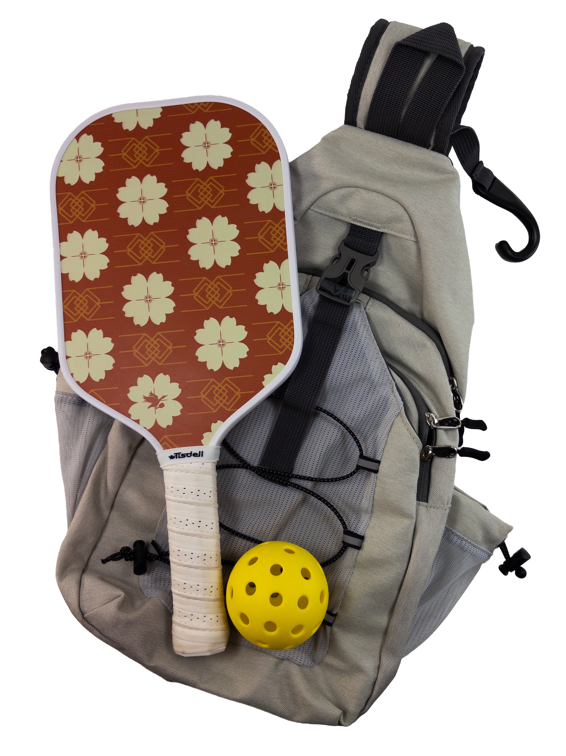 Pickleball paddle with red floral pattern, yellow ball, and gray backpack on a white background