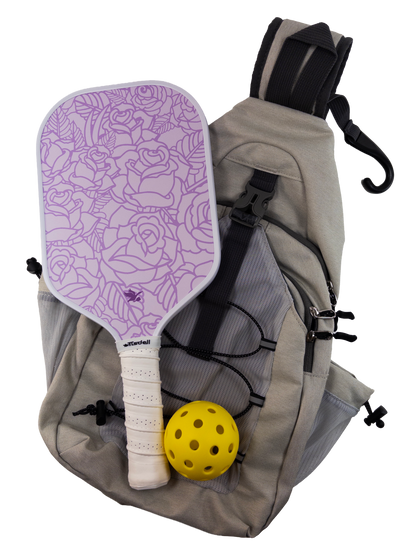 Backpack with rose paddle and yellow ball on a white background
