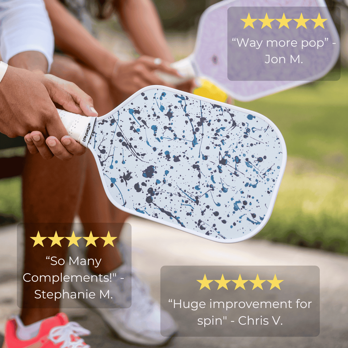 Person holding a pickleball paddle with customer reviews displayed.