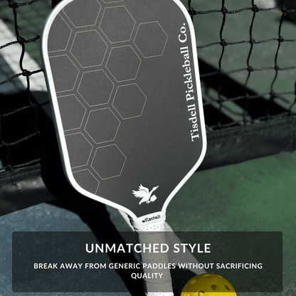 Tisdell pickleball paddle with hexagonal pattern on a pickleball court background