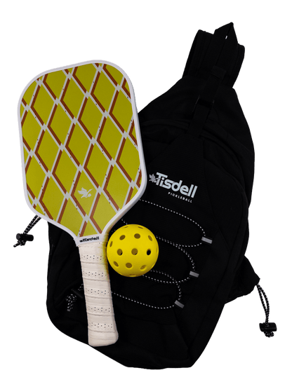 Black bag with Tisdell branding containing a yellow paddle and ball on a transparent background