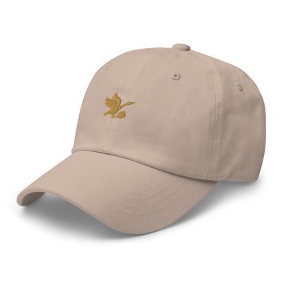 Tan and gold dad hat with Tisdell logo of bird holding a pickleball paddle.