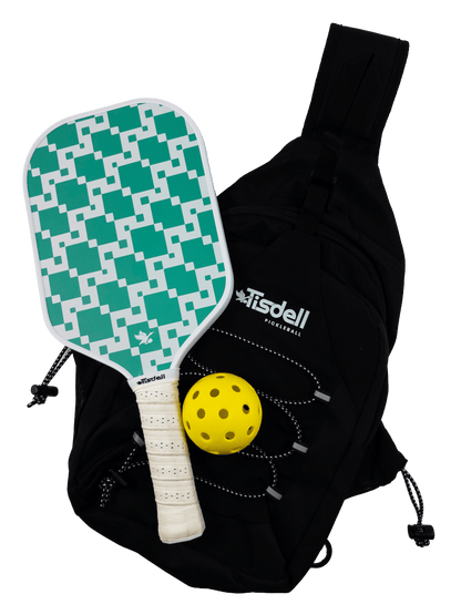 Pickleball paddle with green pattern, yellow ball, and black bag on a transparent background