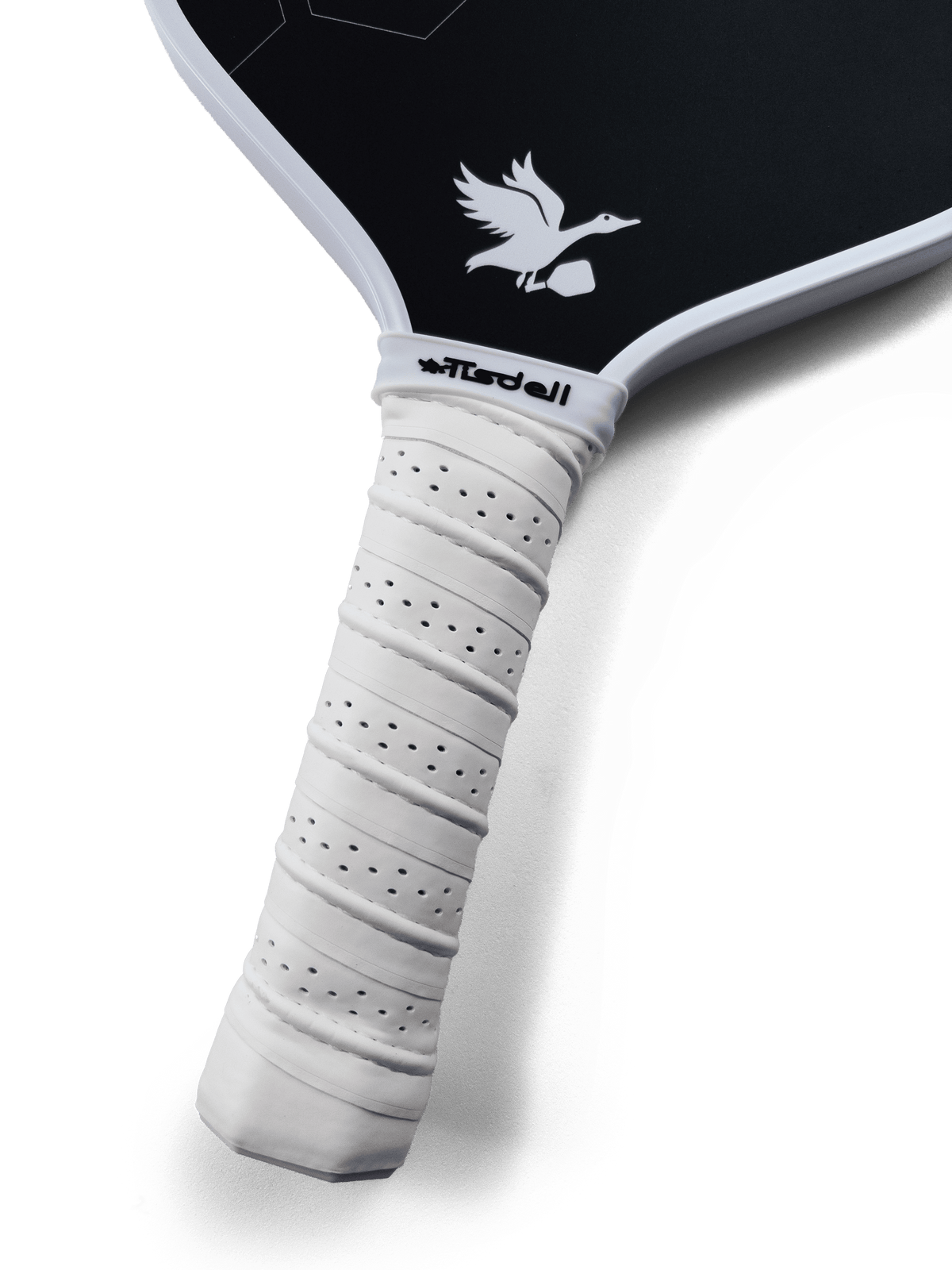 Close-up of a pickleball paddle with a white handle and black surface, featuring a brand logo.