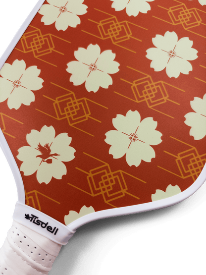 Pickleball paddle with floral pattern and Tisdell branding on a transparent background