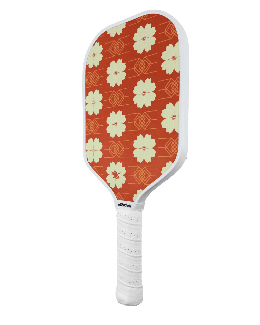 Pickleball paddle with red floral pattern on an white background