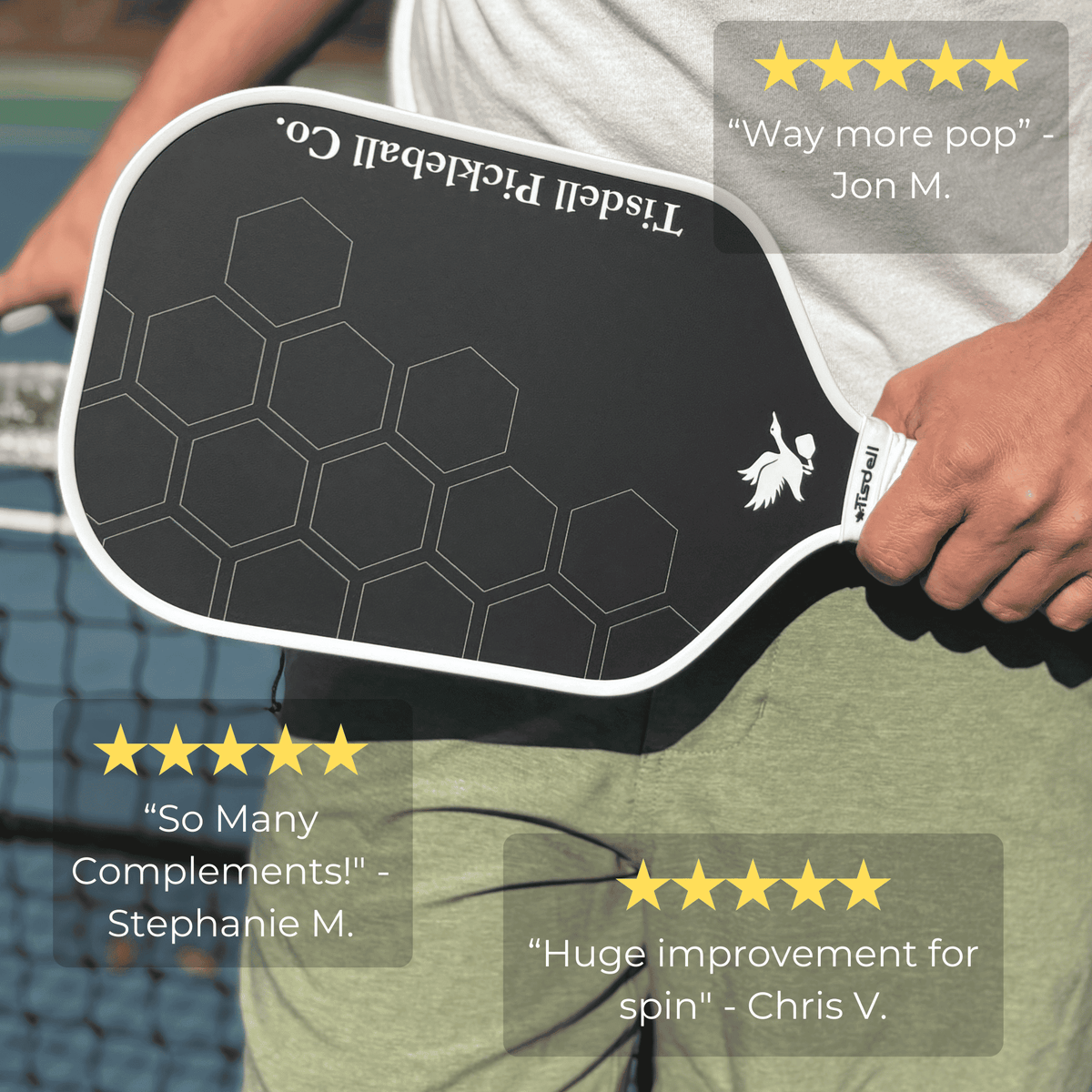 Person holding a Tindell Pickleball paddle with customer reviews displayed.