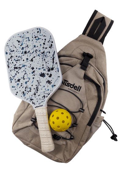Splatter Tisdell paddle with yellow ball and beige bag on a transparent background