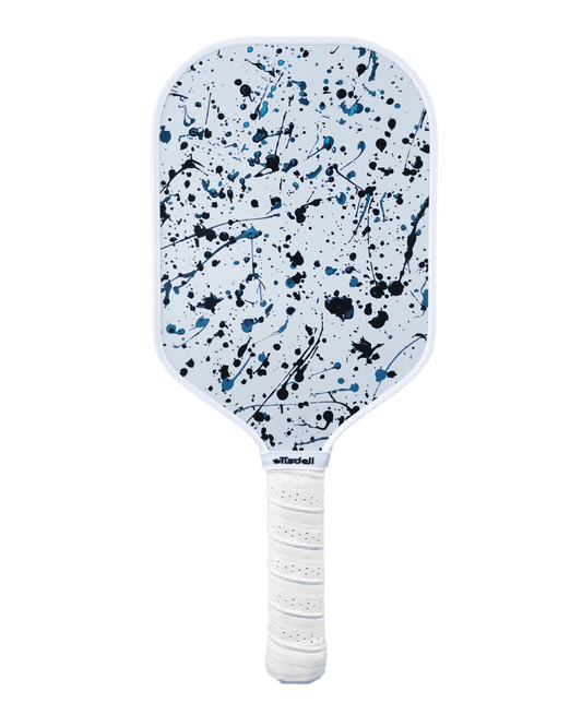 Pickleball paddle with a white handle and blue and black splatter design on a transparent background