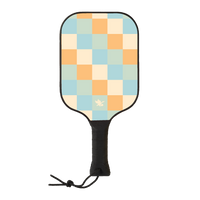 Side view of wooden Tisdell pickleball paddle with a blue, green, and orange checkered pattern and a black wrapped handle from the Inception series.